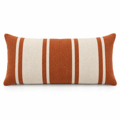 Rectangular burnt orange lumbar cushion cover with wide white vertical stripes on a white background