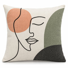 Decorative cushion cover with abstract black line-drawn face and peach, grey and taupe color shapes