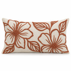 Ivory rectangular lumbar cushion cover with terracotta botanical flower outlines across the front