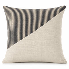 Square cushion cover with diagonal ivory panel and charcoal pinstripe sections on a clean white background