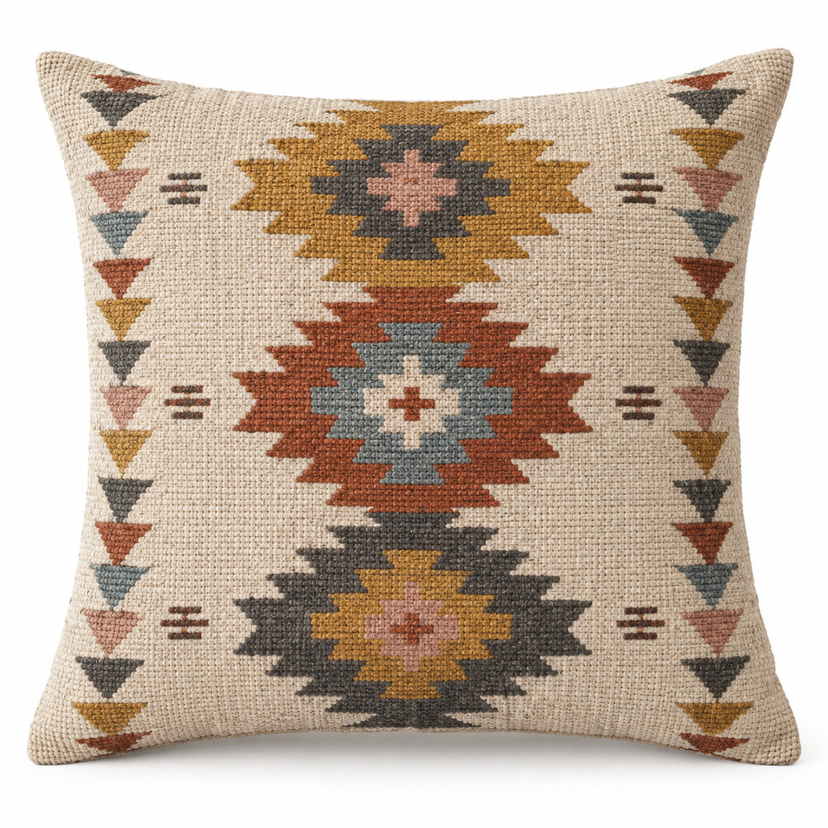 Square kilim-inspired cushion cover with repeating tribal diamonds in rust, blue and mustard
