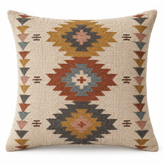 Square kilim-inspired cushion cover with repeating tribal diamonds in rust, blue and mustard
