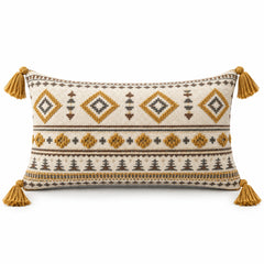 Rectangular cream lumbar cushion cover with mustard geometric tribal motifs and tassel accents