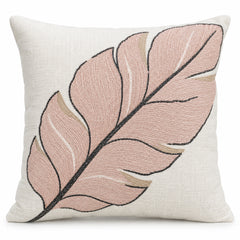Ivory square cushion cover with oversized pale pink feather illustration outlined in dark grey