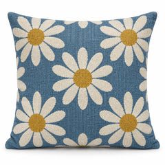 Dusty blue square cushion cover with large cream daisy flowers and mustard yellow centers