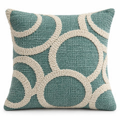 Teal square cushion cover with oversized curved ivory loop shapes and high-low tufted-look texture