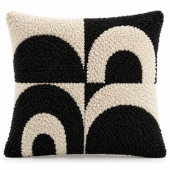 Black and ivory square cushion cover with bold shaggy-looking textured arch and semicircle motifs