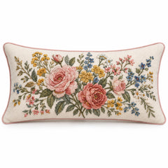 Rectangular ivory lumbar cushion cover with a colorful central floral bouquet in pink, yellow and green