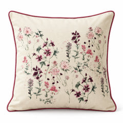 Ivory square cushion with delicate scattered pink botanical flowers and contrasting rose pink edge piping