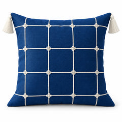 Navy blue square cushion with regular white windowpane grid and ivory corner tassels