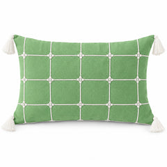 Sage green rectangular lumbar cushion with white windowpane grid and cream corner tassels