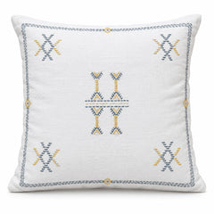 Ivory square cushion with small blue and muted gold geometric tribal motifs and fine border detail