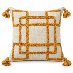 Ivory square cushion with bold mustard yellow crossing rectangular grid lines and tassels at corners