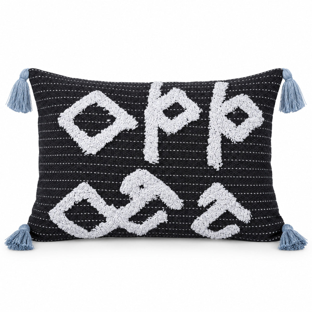 Navy blue rectangular lumbar cushion with oversized ivory tribal geometric motifs and pale blue corner tassels