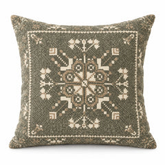 Olive grey square cushion with intricate centered ivory tribal medallion and small border ornaments