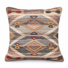 Square cushion with muted rust blue beige and mustard southwestern-style diamond and tribal motifs