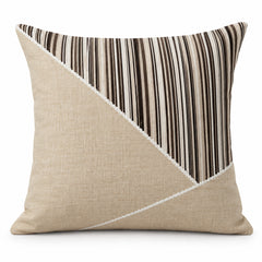 Natural beige square cushion with diagonal ivory panel and black narrow vertical stripes