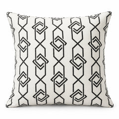Ivory square cushion with tall repeating black connected diamond outlines and vertical geometric stripe pattern