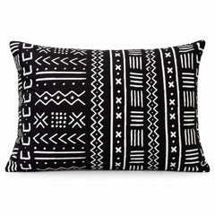 Black square cushion with dense horizontal ivory tribal line and arrow motifs in narrow bands