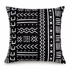 Black square cushion with bold ivory geometric tribal symbols alternating with vertical and horizontal patterned bands