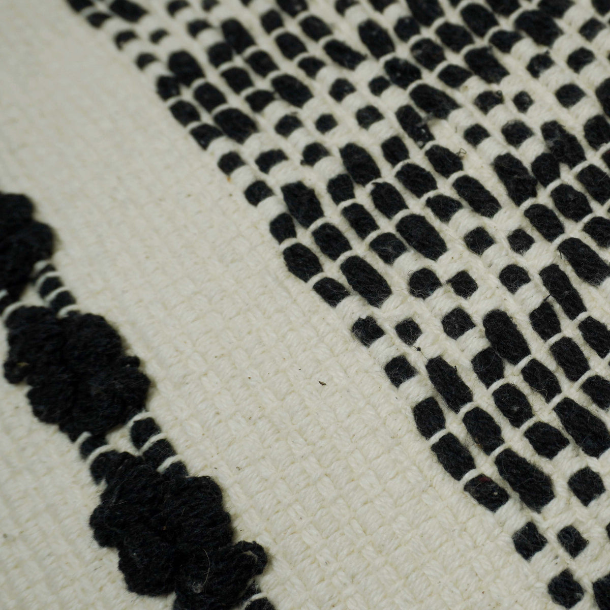 Handwoven Black & Ivory Geometric Textured Cushion Cover with Tassels – 45 x 45 cm