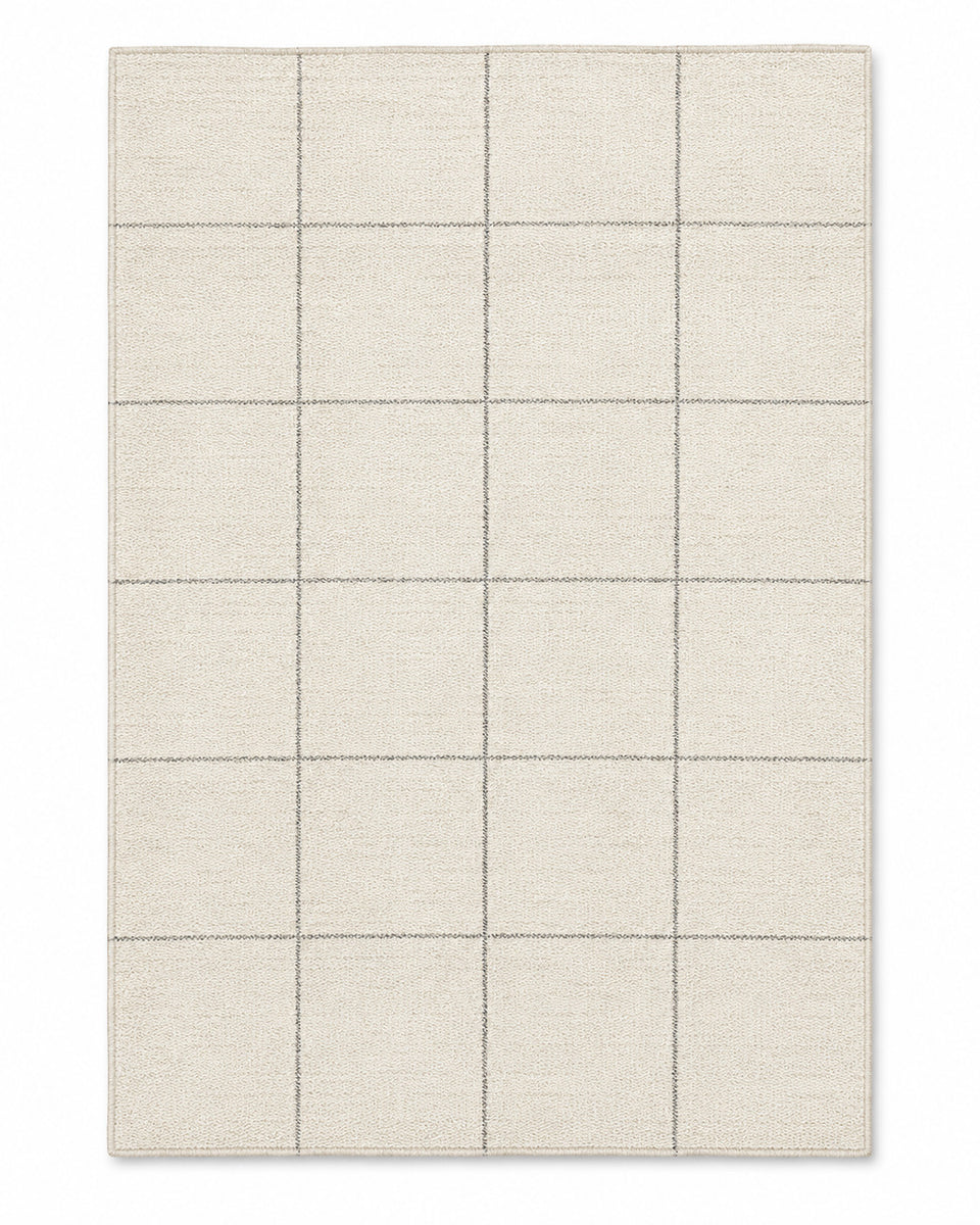 Beige and grey grid-line area rug on a white background.