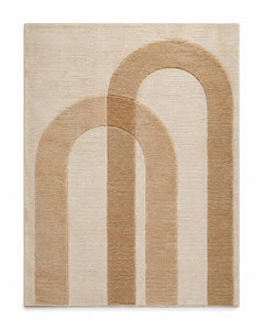 Beige neutral area rug with layered arch motif in warm tan and cream tones