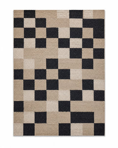 Black, ivory and beige pixel checkerboard area rug for wholesale sourcing from India