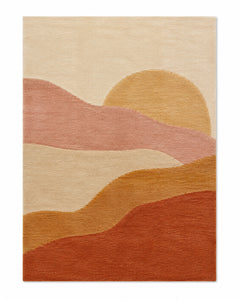Cream area rug with clay, pink and golden sunset-inspired layered landscape shapes