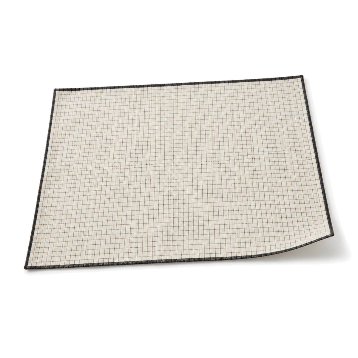 Ivory and black micro-grid placemat shown in a premium angled presentation, modern lightweight table linen by Primeval