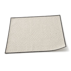 Ivory and black micro-grid placemat shown in a premium angled presentation, modern lightweight table linen by Primeval