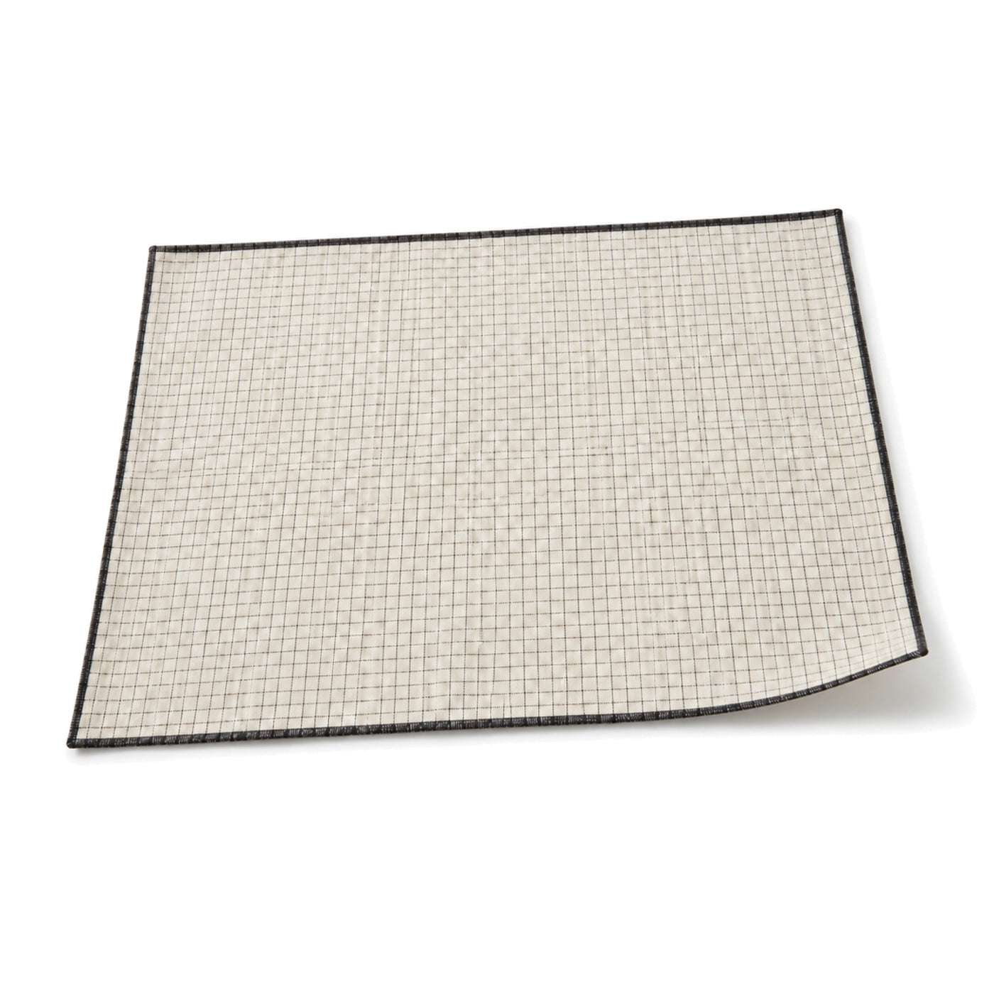 Ivory and black micro-grid placemat shown in a premium angled presentation, modern lightweight table linen by Primeval