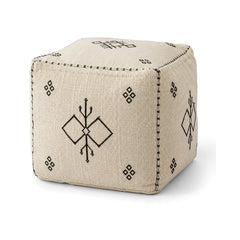 Ivory and black minimal tribal cube pouf ottoman on white background