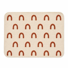 Ivory placemat with repeated rust arch motifs and rounded corners, modern woven dining table mat by Primeval