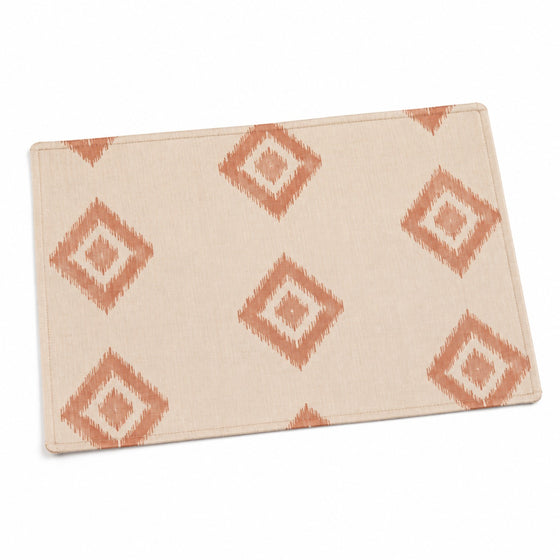 Ivory placemat with terracotta ikat diamond motifs, artisan geometric table linen by Primeval