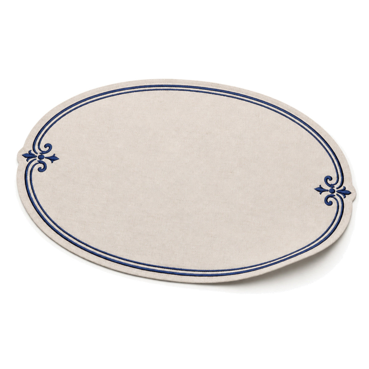 Oval ivory and navy ornamental-border placemat shown in a premium angled presentation, elegant table linen by Primeval