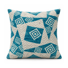 Primeval aqua turquoise and ivory cushion with bold triangular divisions and layered diamond geometric motifs