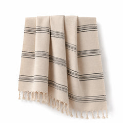 Beige and black striped fringed Turkish cotton hammam towel 90x180 cm on white background