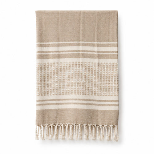 Beige and cream striped fringed cotton hammam towel 90x180 cm on white background