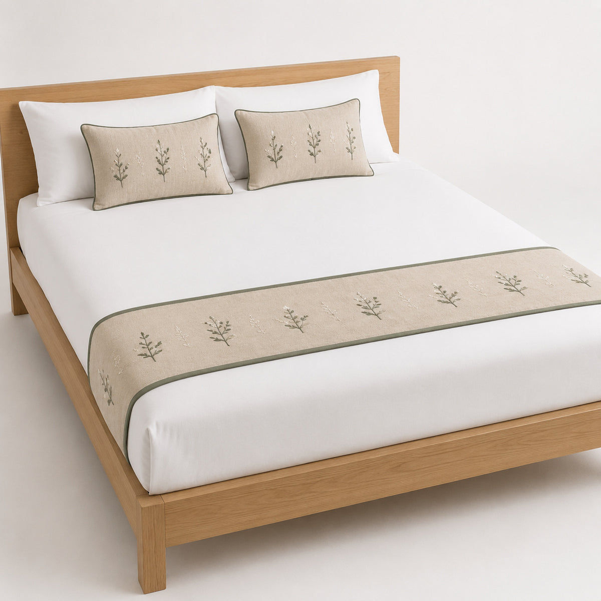 Beige bed runner with delicate repeating motif, styled on white bedding for wholesale hotel and private-label bedroom sourcing
