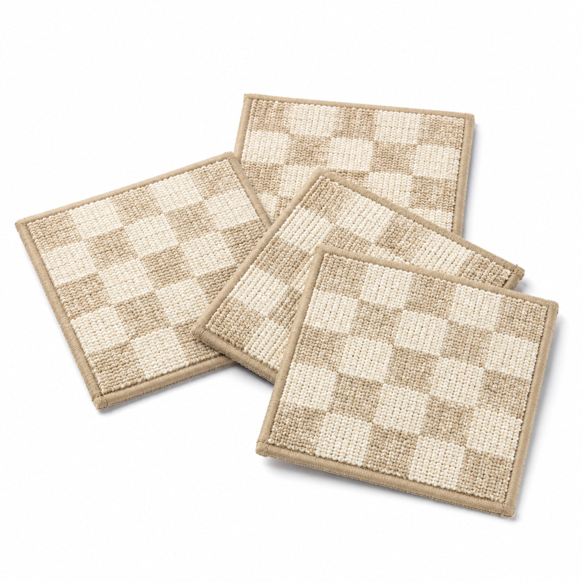 Beige ivory checker textured coaster set on a clean white background