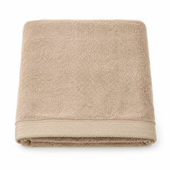Beige luxury dobby border cotton terry bath towel 70x140 cm on white background