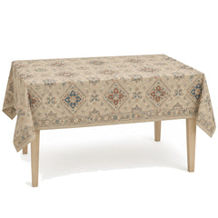 Primeval beige muted blue terracotta ivory decorative woven tablecloth displayed on a rectangular dining table