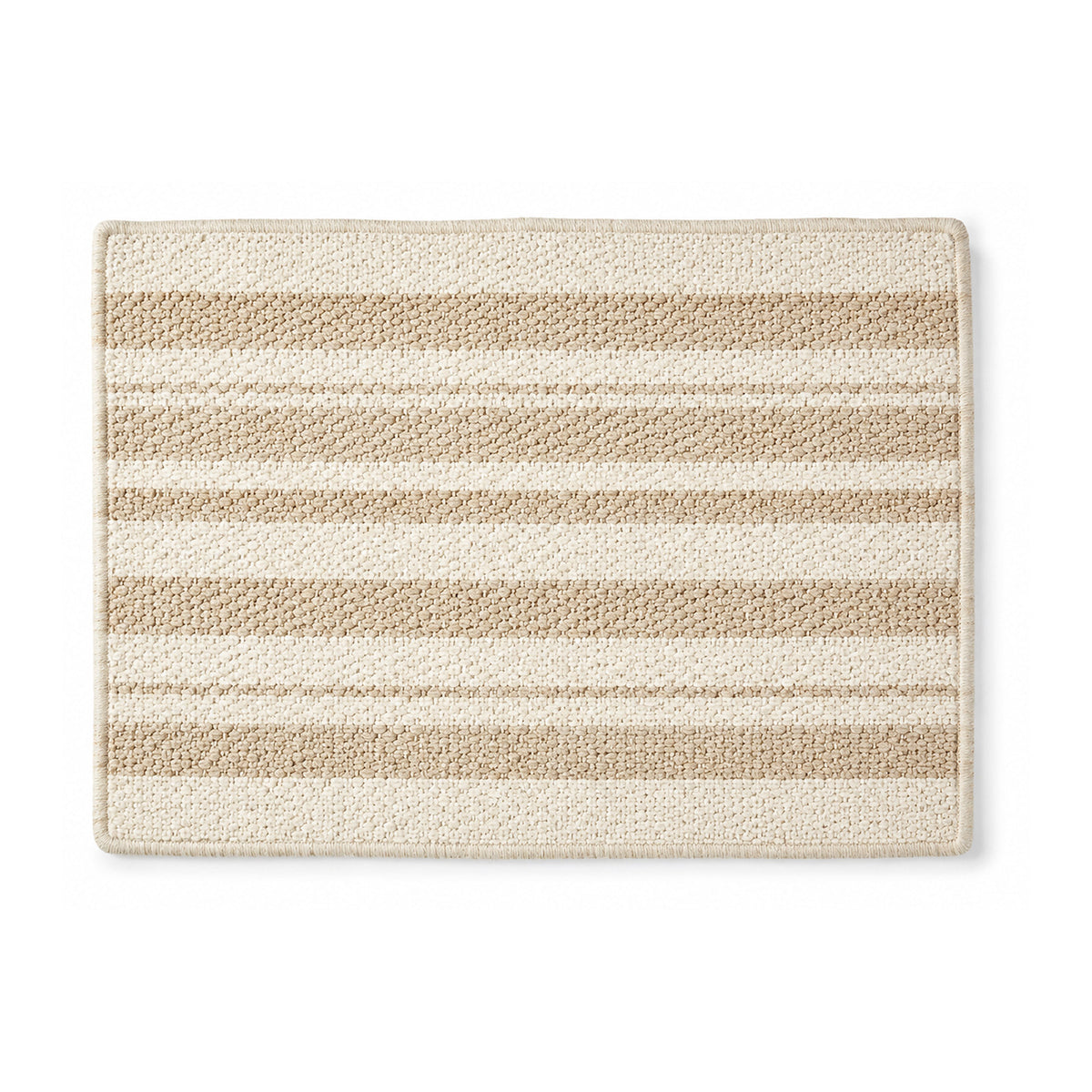 Beige and ivory striped woven bath mat on white background