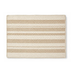 Beige and ivory striped woven bath mat on white background