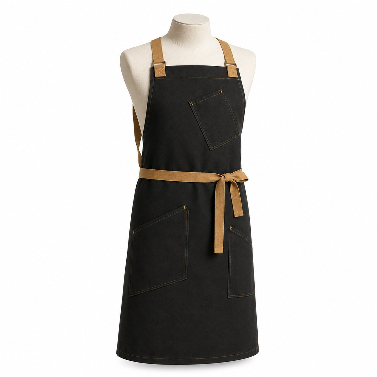 Primeval black chef apron with camel straps and contrast utility pockets displayed on a dress form