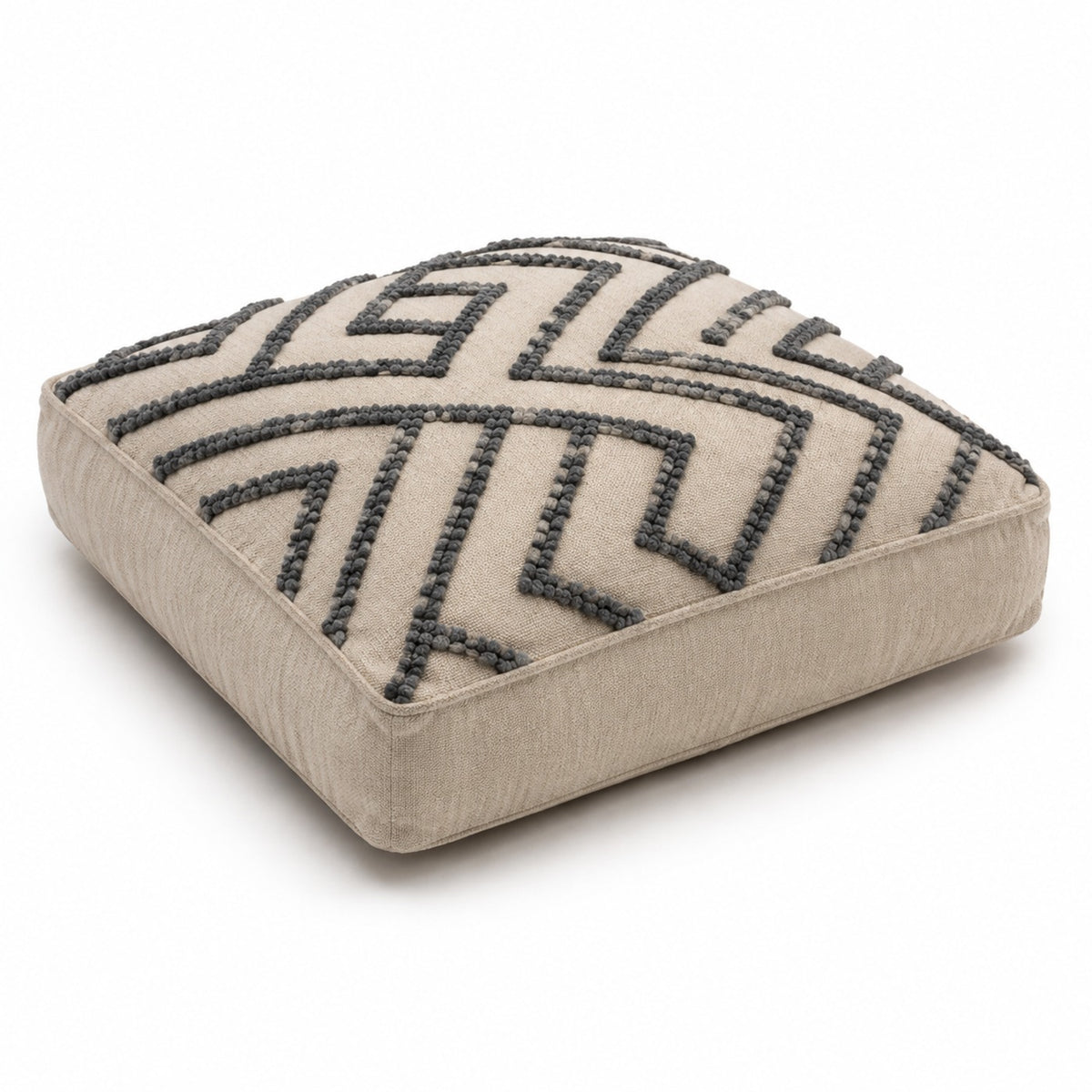 Ivory square floor cushion with bold black chevron raised tufting on white background