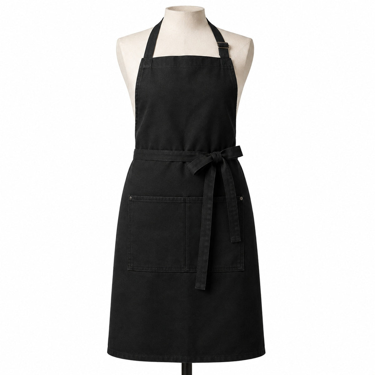 Primeval black chef apron with double front pockets displayed on a dress form