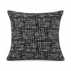Primeval black and ivory cushion cover with tightly interwoven maze-like geometric grid lines