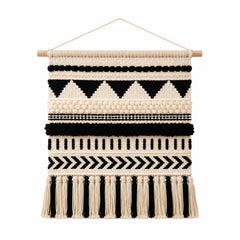 Black and ivory monochrome cotton wall hanging with tribal geometric bands and tassel fringe